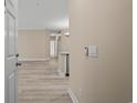 Bright entryway with light flooring and view into living area at 143 Crane Dr. # A, Pawleys Island, SC 29585
