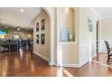 Open living room with hardwood floors and access to Gathering room at 144 Shenandoah Dr., Murrells Inlet, SC 29576