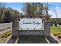 Saddle Ridge community entrance sign with brick pillars and wood pergola at 161 Saddle St, Conway, SC 29527