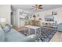 Bright and airy living room with a large TV and coastal decor at 214 13Th Ave. S # C, Surfside Beach, SC 29575
