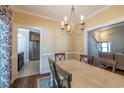 Cozy dining room with chandelier and views into kitchen and living room at 217 Appian Way, Myrtle Beach, SC 29588