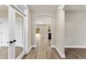 Bright hallway with archway, luxury vinyl plank flooring and views to living areas at 217 Wahee Pl., Conway, SC 29527