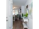 Bright and airy entryway with a console table and view of living room at 306 Westbury Ct. # 2-A, Myrtle Beach, SC 29572