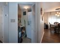 Small laundry closet with washer, dryer, and storage shelves at 306 Westbury Ct. # 2-A, Myrtle Beach, SC 29572