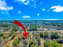 Aerial view showing the property's location near the coast and other buildings at 4281 Hibiscus Dr. # 2-102, Little River, SC 29566