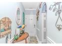 Bright and airy entryway with a console table and welcoming decor at 4281 Hibiscus Dr. # 2-102, Little River, SC 29566