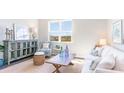 Living room with a white sofa, arm chair, and coastal decor at 538 Firouz Dr, Longs, SC 29568