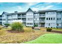 Building exterior with grilling and lawn area at 5905 South Kings Hwy. # 6310-D, Myrtle Beach, SC 29575