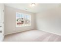 Well-lit bedroom with carpet flooring and large window at 622 Lightwood Dr., Conway, SC 29526