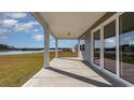 Spacious covered patio overlooking a serene lake at 822 Ireland Dr., Longs, SC 29568