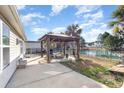 Relaxing backyard patio with gazebo, fire pit, and pond view at 823 Trap Shooter Circle, Longs, SC 29568