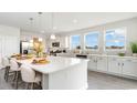 Modern kitchen with white cabinets, large island, and stainless steel appliances at 834 Ireland Dr., Longs, SC 29568