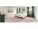 Spacious main bedroom with plush bed and large windows at 834 Ireland Dr., Longs, SC 29568