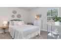 Charming bedroom with a light teal headboard and floral bedding at 842 Ireland Dr., Longs, SC 29568