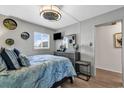Bedroom featuring stylish ceiling fan, dresser with mirror, and comfortable bed at 1012 N Waccamaw Dr. # 204, Murrells Inlet, SC 29576