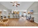The living room features attractive wood flooring, a ceiling fan and plenty of natural light at 1240 Pineridge St., Conway, SC 29527