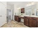 Bright bathroom with double sinks, dark cabinets, vanity space and access to the shower and bedroom at 129 Yeomans Dr., Conway, SC 29526