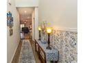 Bright entryway with decorative wallpaper and a console table at 136 Timber Oaks Dr., Myrtle Beach, SC 29588