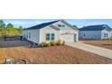Rear view of the house showcasing the backyard and side yard at 144 Rutland Ct., Conway, SC 29526