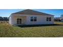 Spacious backyard with covered patio, ideal for outdoor entertaining at 1455 Porchfield Dr., Conway, SC 29526