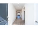 Bright and airy entryway with wood-look flooring, leading to the living area at 1455 Porchfield Dr., Conway, SC 29526