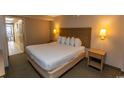 Double bed and nightstand in a comfortable condo bedroom at 1501 S Ocean Blvd. # 1542, Myrtle Beach, SC 29577