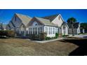 Craftsman style home with stone accents and sunroom addition at 160 Stonegate Blvd. # 160, Murrells Inlet, SC 29576