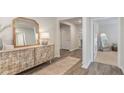 Light-filled hallway featuring a decorative console table and mirror at 201 Jeff Waters Circle, Longs, SC 29568