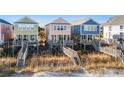 Three beach houses with oceanfront walkway access at 2022 N Waccamaw Dr., Garden City Beach, SC 29576