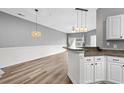 Open concept dining area with hardwood floors and kitchen views at 209 Wando River Rd. # 10C, Myrtle Beach, SC 29579