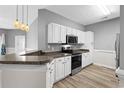 Modern kitchen with stainless steel appliances and an island at 209 Wando River Rd. # 10C, Myrtle Beach, SC 29579