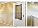 Exterior condo building front door at 2225 Essex Dr. # F, Surfside Beach, SC 29575