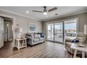 Comfortable seating area with glass sliding door and cozy accent pieces at 301 43Rd Ave. N, North Myrtle Beach, SC 29582