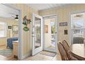 Charming entryway with beach-themed decor, leading to a bedroom and an outdoor patio at 306 59Th Ave. N, North Myrtle Beach, SC 29582
