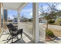 Relaxing front porch with two rocking chairs, overlooking the neighborhood at 327 Simplicity Dr., Murrells Inlet, SC 29576