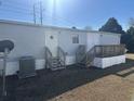 Rear view of mobile home showing additional deck and AC unit at 3802 Stern Dr., Conway, SC 29526