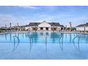Beautiful community pool offering ample seating, umbrellas and palm trees for a resort-like experience at 4040 Bucolic Loop, Myrtle Beach, SC 29588
