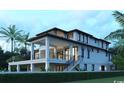 Angle view of a modern, multi-story home featuring multiple balconies, surrounded by a neatly manicured lawn at 4702 N Ocean Blvd., Myrtle Beach, SC 29577