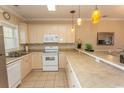 Bright kitchen featuring white cabinets and tile flooring at 4809 Luster Leaf Circle # 102, Myrtle Beach, SC 29577