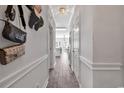 Bright hallway with tile floors and access to other rooms at 4870 Dahlia Ct. # 19-103, Myrtle Beach, SC 29577