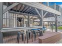 Covered outdoor bar with seating and golf cart at 6001-1028 S Kings Hwy., Myrtle Beach, SC 29575