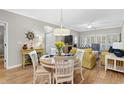 Charming dining area with a round table and four chairs at 601 N Hillside Dr. # 4223, North Myrtle Beach, SC 29582