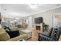 Bright living room with fireplace and comfy seating at 601 N Hillside Dr. # 4223, North Myrtle Beach, SC 29582