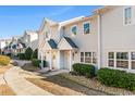 Row of townhouses with neatly landscaped yards and walkways at 618 3Rd Ave. S # 4B, North Myrtle Beach, SC 29582