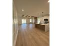 Open concept kitchen, island, white cabinets, wood beams at 640 Carter Reid Ct., Conway, SC 29526