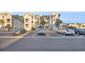 View of the parking area in front of the condo complex, providing convenient parking spaces for residents at 661 Tupelo Ln. # 16B, Longs, SC 29568