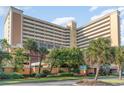 Resort hotel showcasing its architecture and landscaping at 6900 N Ocean Blvd. # 1439, Myrtle Beach, SC 29572