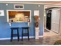 Stylishly decorated pass-through, wood cabinets, granite countertops and bar seating adds to the appeal of this unique home at 706 33Rd Ave. S, North Myrtle Beach, SC 29582