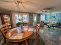Cozy living area featuring stylish furniture, wood-look floors, and abundant natural light at 706 33Rd Ave. S, North Myrtle Beach, SC 29582