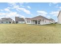 Large backyard with grassy area. Views of neighboring homes at 7085 Shooting Star Way, Myrtle Beach, SC 29579